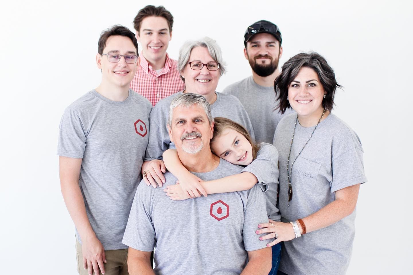 The Hanlon family, Jay, Karen, their children, and granddaughter, in matching Filter Tech shirts